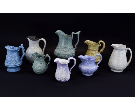 A Very Good Collection of Mid 19th Century Moulded Jugs Decorated In High Relief ( 8 ) Jugs In Total. Various Factories, Incl