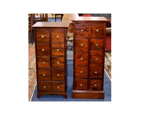 A Pair Of Dark Wood Chest Of Drawers Two square, ten drawer chests of plain form with brass pull handles. The first 41 inches