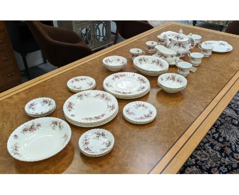 A ROYAL ALBERT 'LAVENDER ROSE' PART DINNER AND TEA SET, including six cups, six saucers, eight side plates, teapot, milk jug,