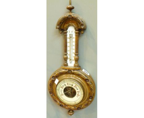 ANEROID BAROMETER. Victorian carved wood aneroid barometer thermometer, L: 60 cm