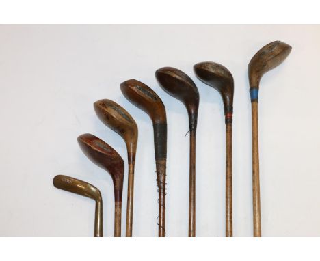 Group of seven hickory shafted golf clubs to include R Forgan of St Andrews spoon type wood, etc. within vintage golf bag.&nb