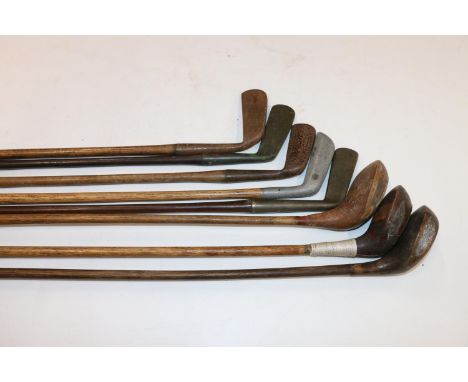 Group of eight hickory shafted golf clubs to include Simpson of Edinburgh putter, R Forgan and Son of St Andrews putter, etc.