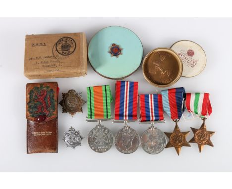 World War Two medals to include a Defence medal, two WWII war medals, 1939-1945 star and Italy star in issue box addressed to