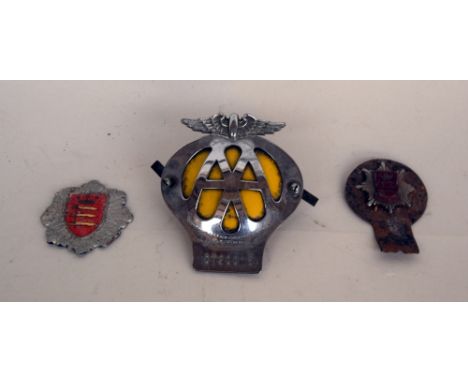 A 1964 Middlesex Fire Brigade helmet badge and engine badge, together with a vintage AA Club grille badge, serial no. 0T20015