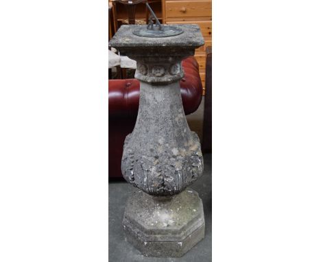 A stone garden sundial with octagonal base and with rosette and acanthus carvings, 106cmH