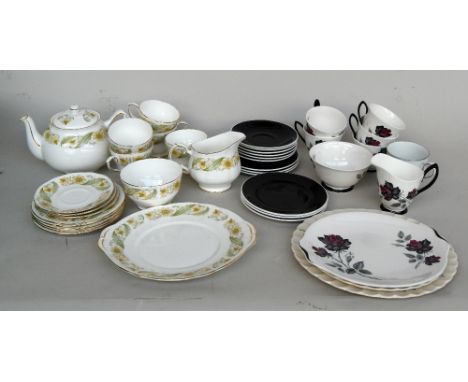 A part tea service by Duchess in the 'Greensleaves' pattern, comprising a teapot, teacups, plates and saucers and a part tea 