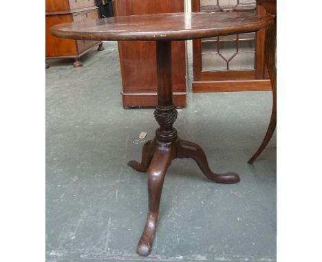 A circular table on a tripod base, 75cmD, 70cmH