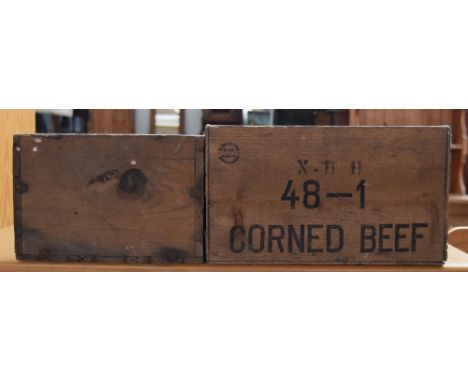 Two vintage wooden food crates, one labelled 'Corned Beef'