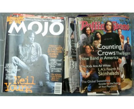 A box of vintage music magazines including Rolling Stone and Mojo