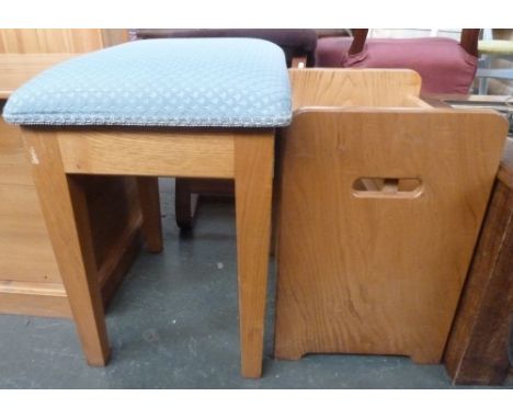 A pine stool with hinged top and storage space in light blue upholstery, 37 x 46 x 52cmH, together with a pine canterbury, 46