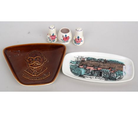 A Poole Pottery cruet set in traditional pattern together with two Hardy based dishes