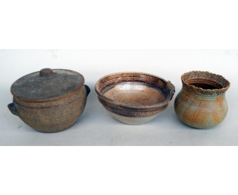 Three studio pottery bowls, bearing the marks: an 'R' in a square, a lowercase 'f' with two dots, and a flower with four peta