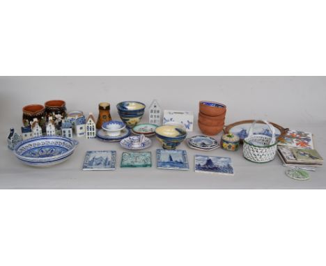 A selection of hand-painted continental ceramics, including a pair of Delft tiles titled 'Delft' and 'S Gravenhage' and a sma