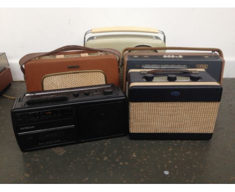 Four vintage radios: a Dynatron Nomad, a Decca AM/FM Transistor, a Roberts radio and a Bush TR 82C, together with a Hitachi T