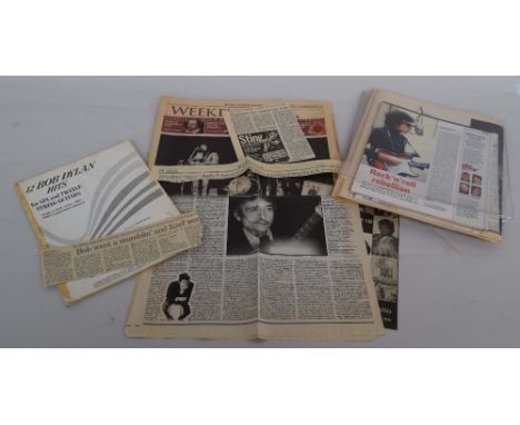 A number of Bob Dylan news clippings and sheet music