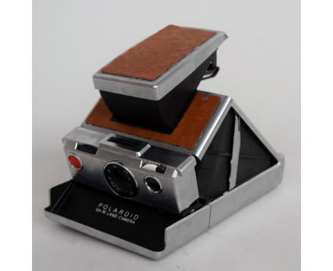 A Polaroid SX-70 Land Camera with leather sections in original container
