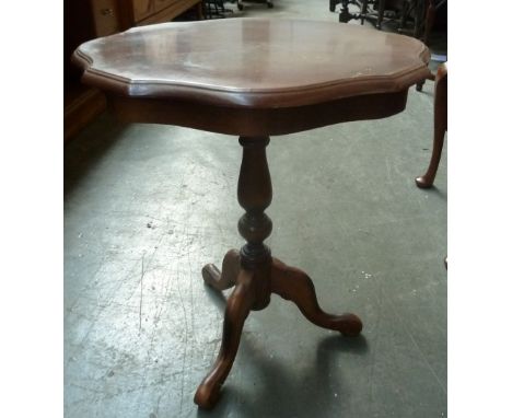 An occasional table on a tripod base with outswept cabriole legs, 52cmD and 59cmH, together with a floor lamp with wooden tur
