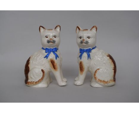 A pair of ceramic cat figurines 21cmH