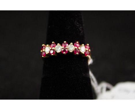 RUBY + DIAMOND RING SET IN 18CT YELLOW GOLD. 10 RUBIES + 4 DIAMONDS