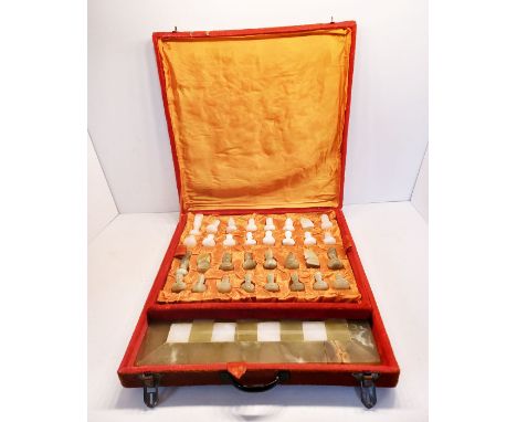 A CASED ONYX CHESS SET