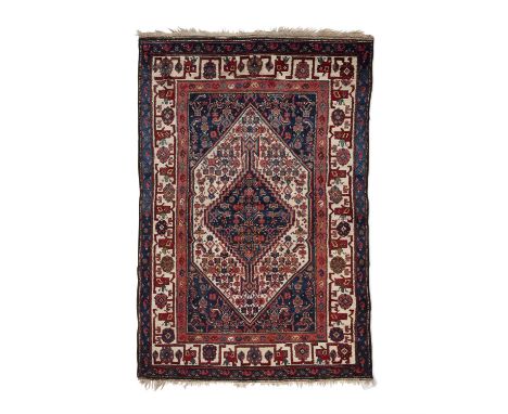AN ANTIQUE KURDISH RUG,hand knotted by Kakaberu Kurdish weavers, Sanandaj region, W. Persia, early 20th century, with hexagon