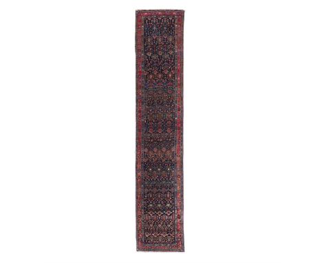AN ANTIQUE BIDJAR RUNNER,hand knotted by Kurdish weavers from the Bidjar town area, west Persia, c. 1880-1900, with all-over 