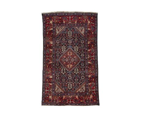 AN ANTIQUE MAHAL RUG,hand knotted in the Arak-Ferahan region of W. Persia, c.1890-1910, with a centre diamond shaped arrow me