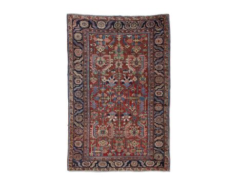 AN ANTIQUE HERIZ CARPET,hand knotted in the village region of Georavan, Heriz district, N.W. Persia, c.1885-1910, with all-ov