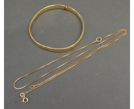 A 14ct. Gold Bangle together with a 14ct. gold fine neck chain, 10.8 gms