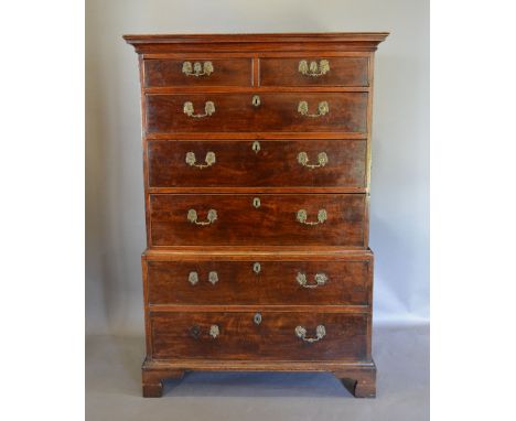 A George III Mahogany Chest on Chest, the moulded cornice above two short and five long graduated drawers with brass handles 