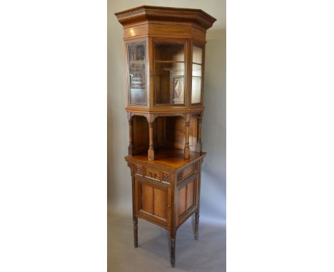 A Victorian Rosewood Cabinet by Howard & Sons, the moulded cornice above a glazed door enclosing glass shelf above a quadrupl