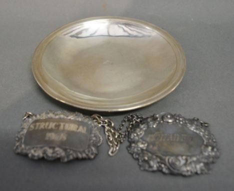 An Early Continental White Metal Dish, together with two decanter labels