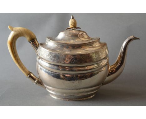 A George III Irish Silver Teapot by John Whelpley, Cork, with shaped handle and finial in the form of a pineapple and with en