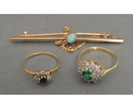 A 9ct. Gold Cluster Dress Ring, together with another similar and a yellow metal opal set bar brooch, 5 gms