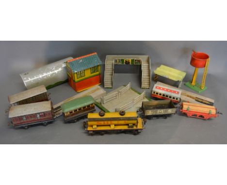 Two Hornby 0 Gauge Carriages together with five other rolling stock to include a Marklin Shell Tanker together with a collect