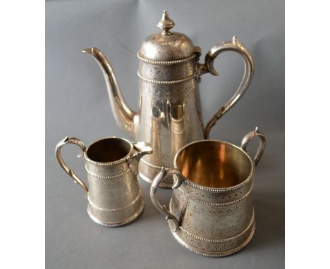 A Victorian Silver Three Piece Coffee Service comprising coffee pot, two handled sucrier and cream jug with stylised engraved