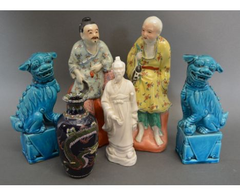 A Pair of Chinese Porcelain Models of Tradesmen, together with a pair of blue glazed Dogs of Fo, a Blanc de Chine figure and 