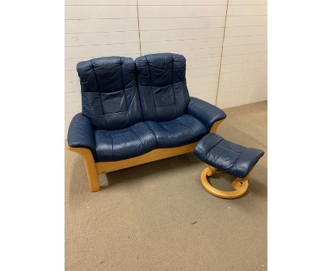 A Ekornes Scandinavian Stress less Windsor recliner sofa and foot stool (H107cm W150cm D72cm)