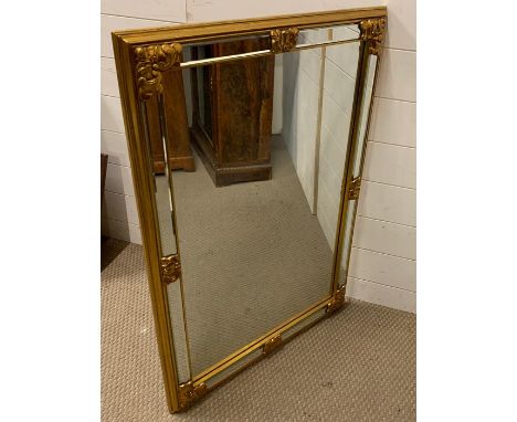 A large gilt framed mirror (96 h x 69cm )