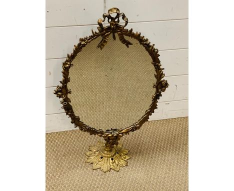 A brass table top ribbon mirror (65cm x 40cm)