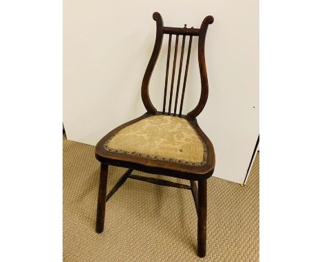 A Hall chair with harp shaped back.
