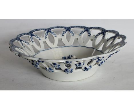 A Worcester Pine Cone pattern shaped circular basket, printed in underglaze blue with peony between two pine cones and a pome