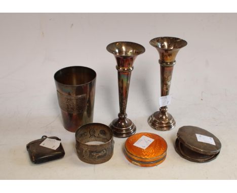 A silver and enamel compact; a silver vesta case; a pair of weighted silver bud vases; a plated Polish military beaker, etc (