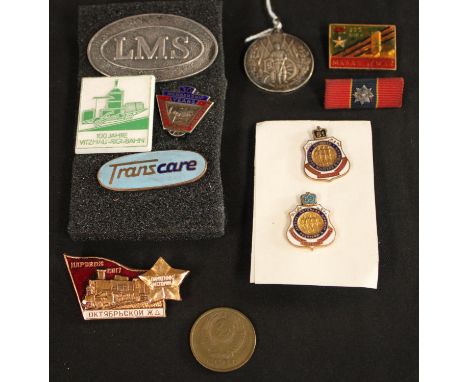A Russian 1915-1917 medallion; a Russian enamel badge; another, similar; a National Union of Railwaymen 30 years silver badge