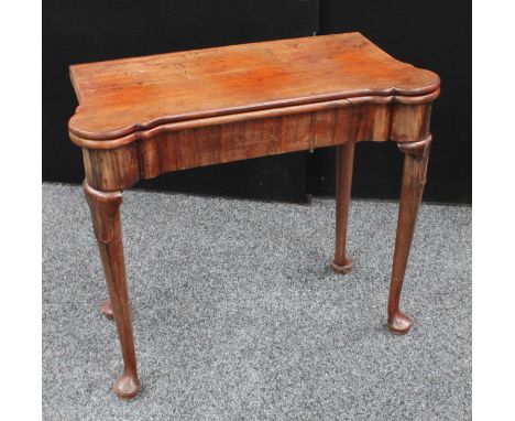 A George II Irish mahogany concertina action card table, folding top enclosing an inset baize lined playing surface with coun