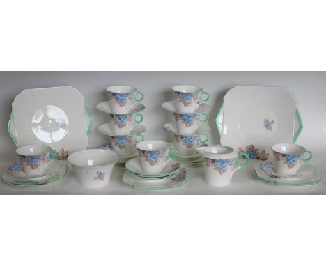 A Shelley floral pattern part tea service comprising 9 cups, 12 saucers, 10 side plates, 2 cake plates, cream jug and sugar b