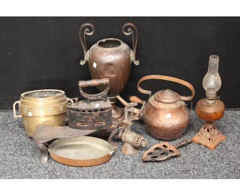 Metalware - a copper samovar, later converted to a vase; a Middle Eastern copper kettle; box/slug iron; cast iron trivet; oil