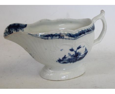 A Worcester sauce boat, with slightly curved vertical moulding, painted with two slightly differing panels of a man in a boat