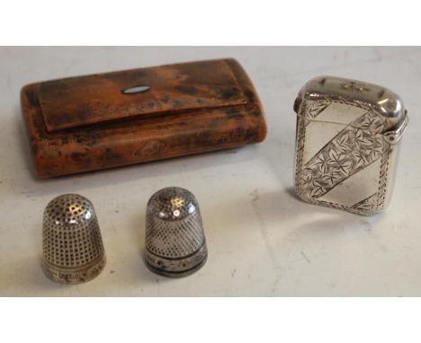 A silver vesta case, Chester 1903; a walnut snuff box; thimbles (4)