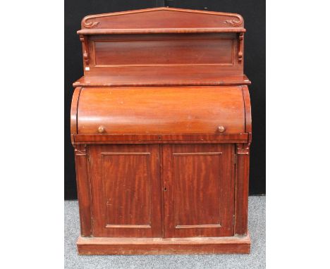 A Victorian mahogany cylinder chiffonier, pointed arched shelved gallery above a retractable front enclosing a writing surfac